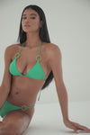 Model in green triangle bikini top