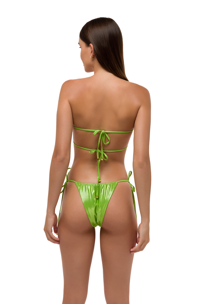 Model in greenmetallic ruched bikini bottoms back