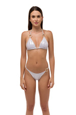 Model in silver metallic bikini top